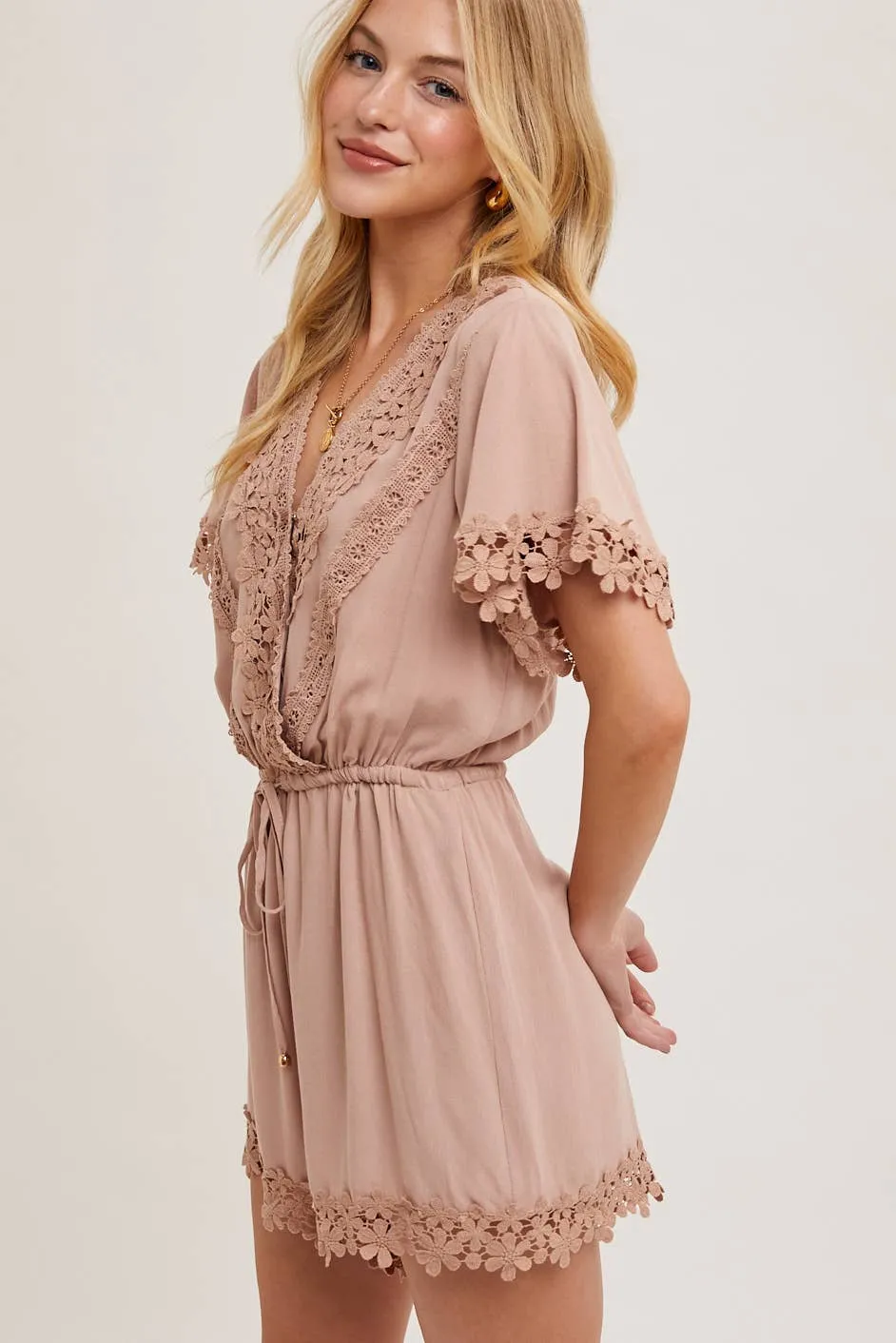 WRAP FLORAL LACE TRIMMED DRAWSTRING ROMPER: ALMOND